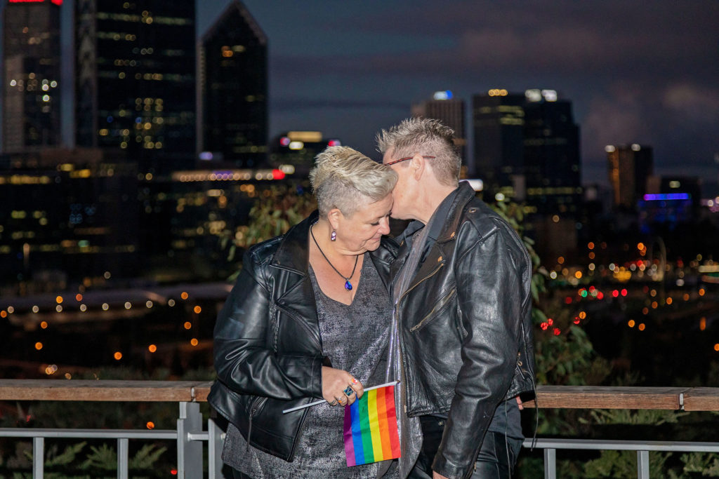 Gay brides with perth skyline from Kings Park at sunset